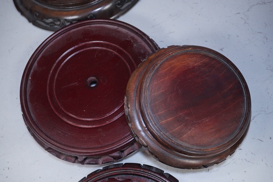 Eight assorted Chinese hardwood vase stands. Condition - fair to good